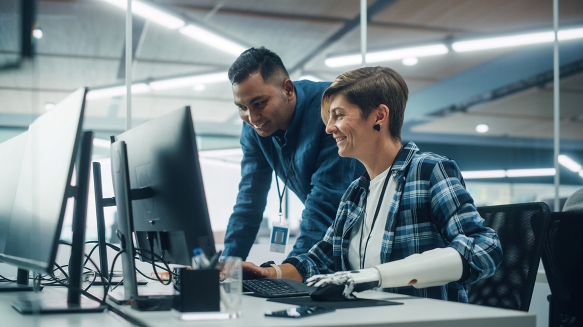 Two people working together in an office.