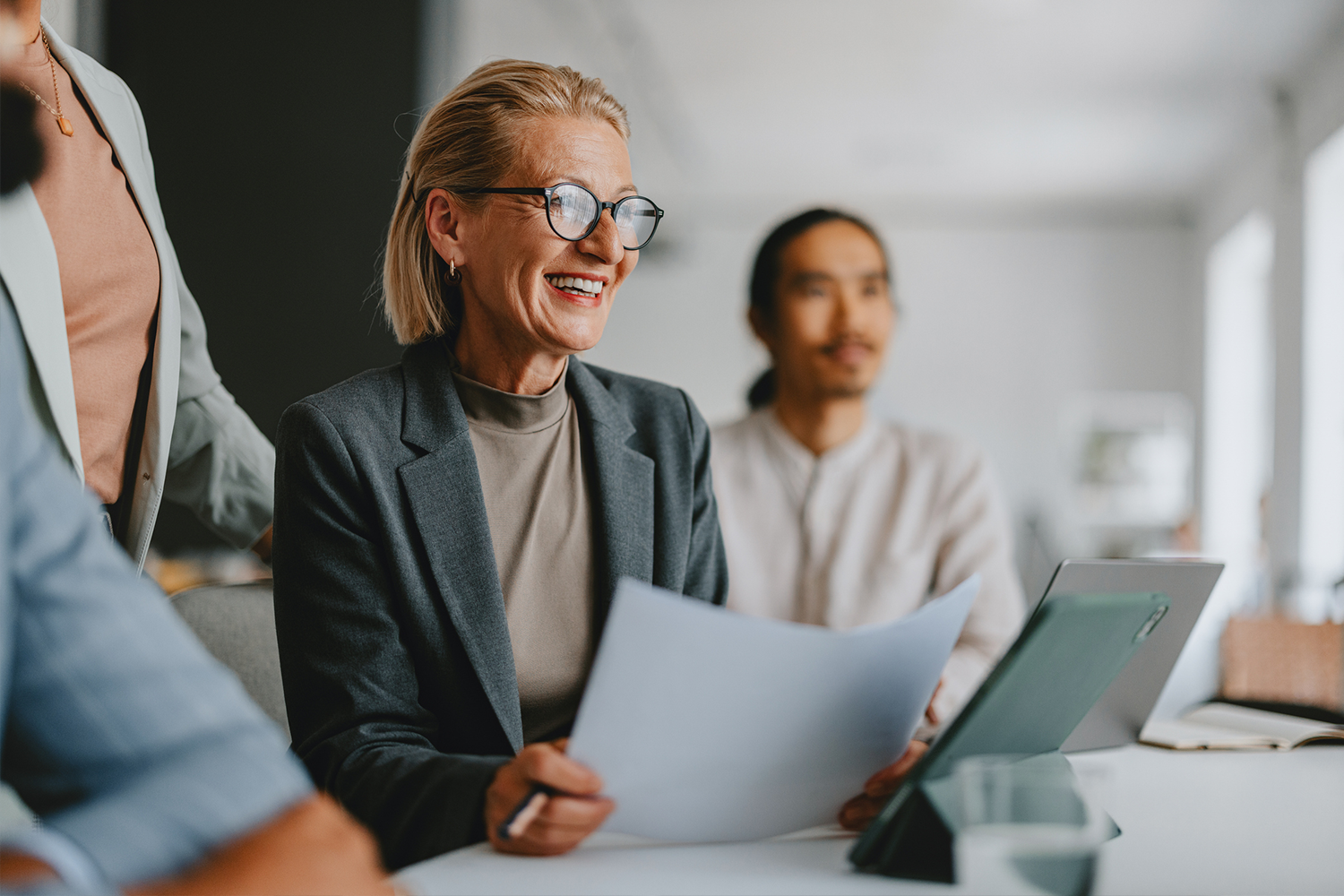 Woman discussing with team in a meeting.